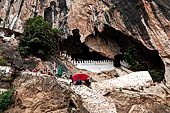 Luang Prabang, Laos - The Pak Ou Buddha Caves. The caves are set into the sheer limestone cliff at the confluence of the Mekong and Nam Ou rivers. Laos 